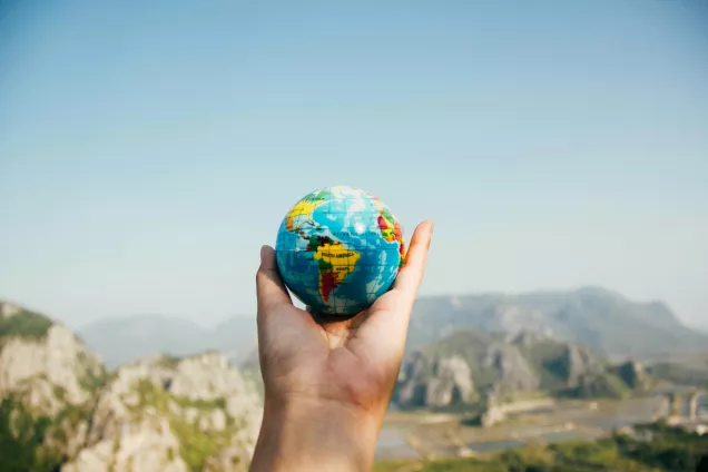 Hand holding a globe. photo